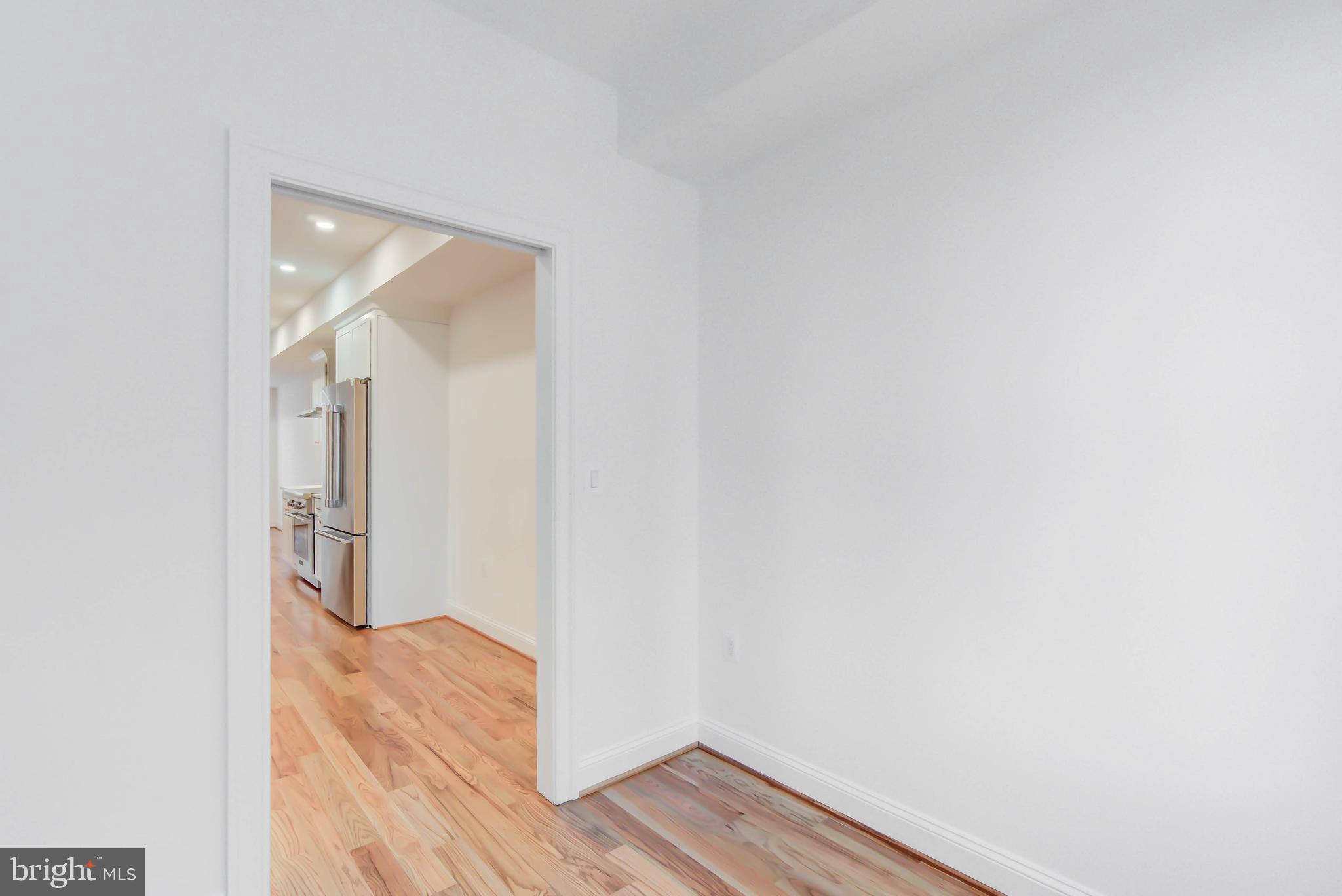 2910 18th Street Northwest Washington, DC 20009 - Photo 17 of 54 a view of empty room with wooden floor