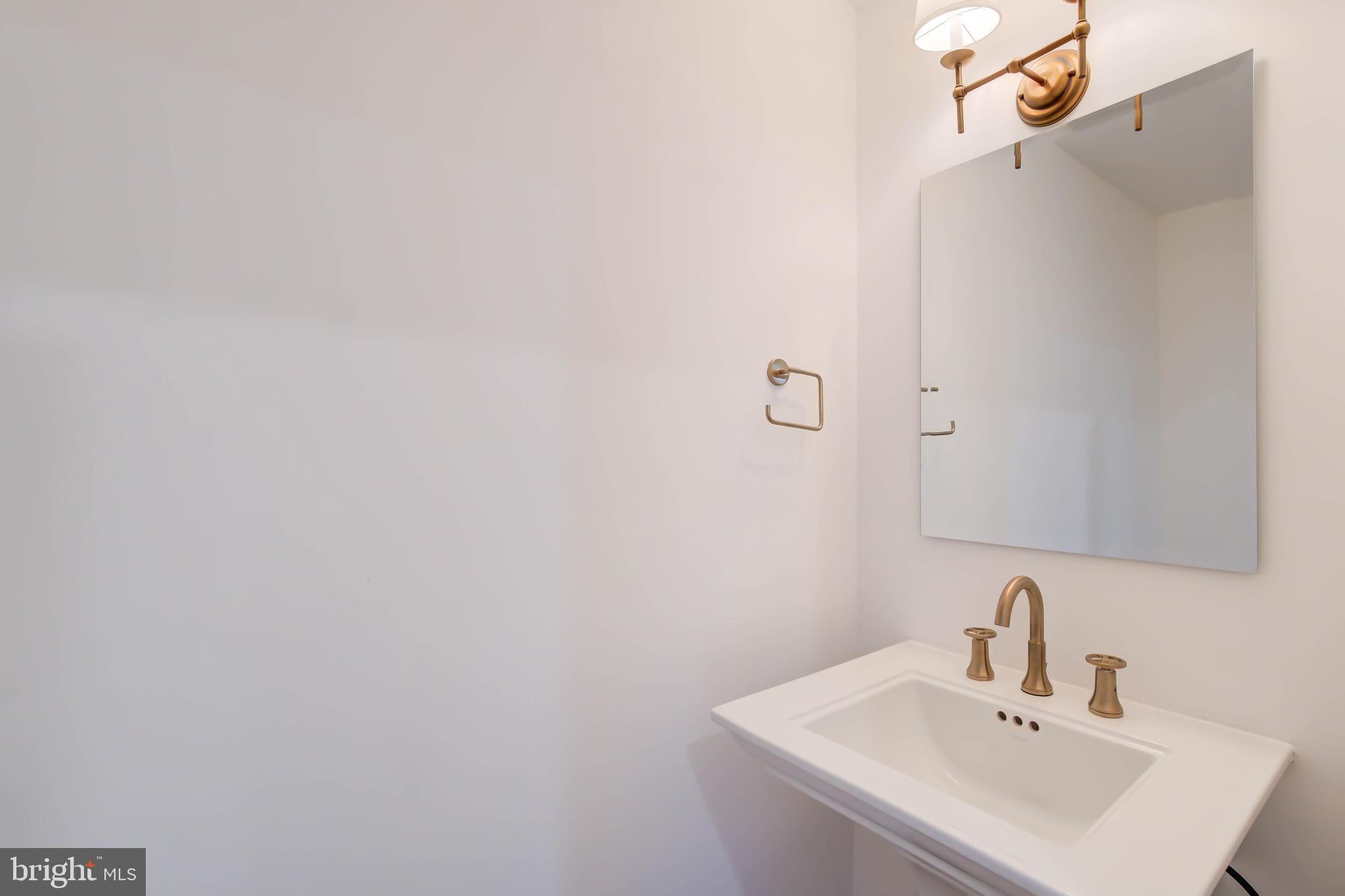 2910 18th Street Northwest Washington, DC 20009 - Photo 18 of 54 a bathroom with a sink a mirror and shower