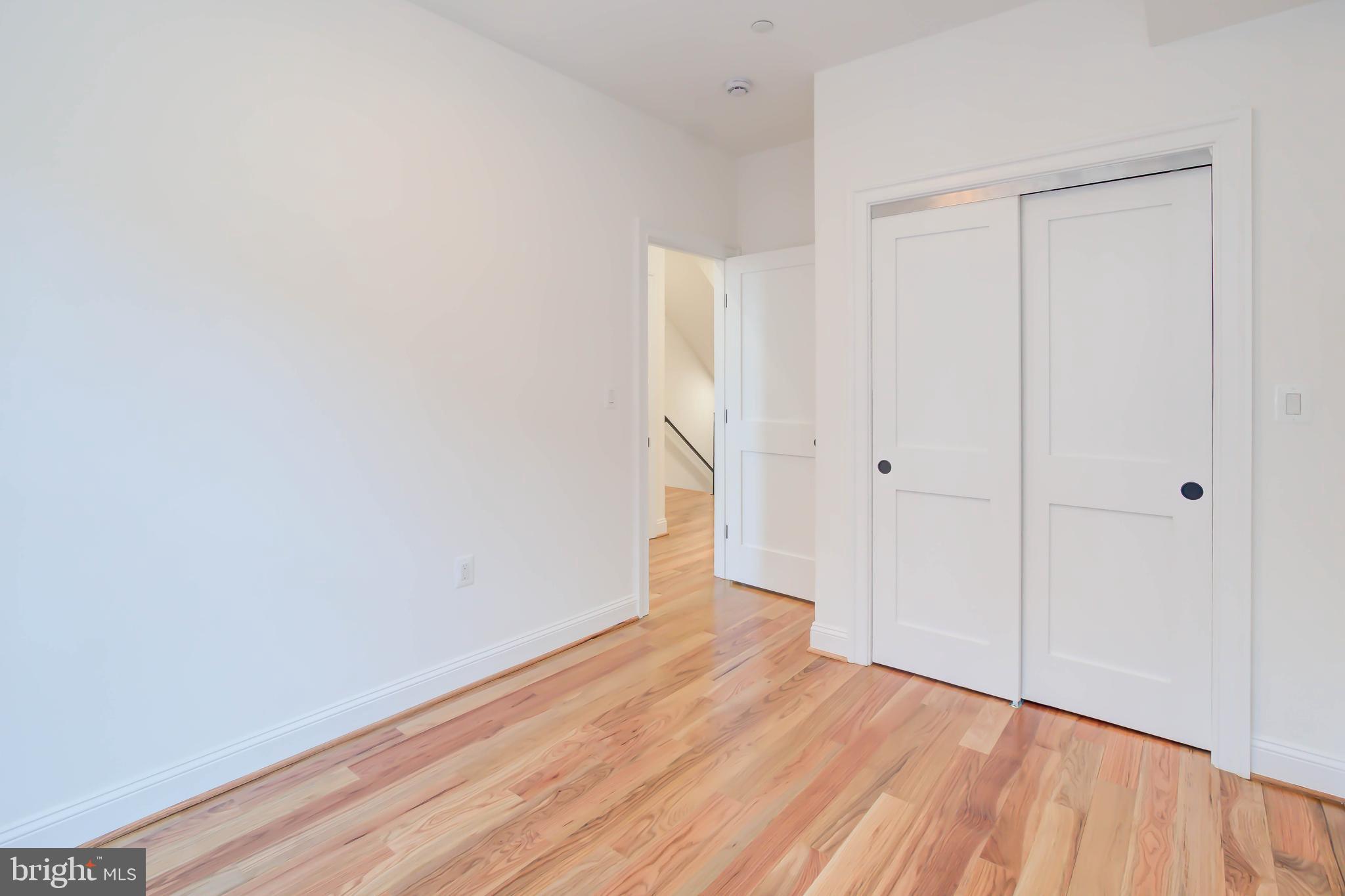 2910 18th Street Northwest Washington, DC 20009 - Photo 30 of 54 a view of an empty room with wooden floor