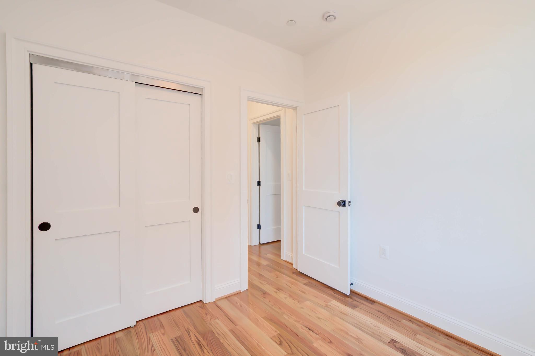 2910 18th Street Northwest Washington, DC 20009 - Photo 32 of 54 a view of a hallway with wooden floor