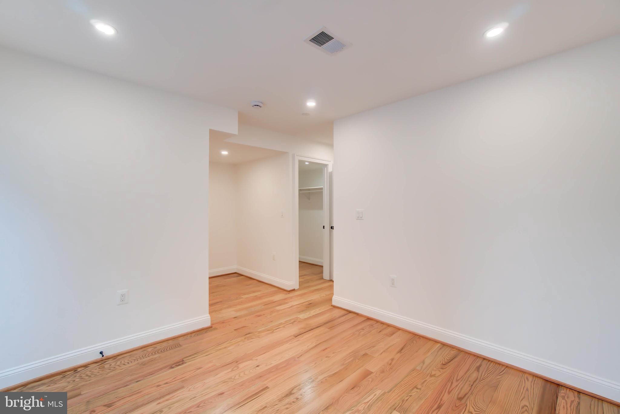 2910 18th Street Northwest Washington, DC 20009 - Photo 47 of 54 a view of an empty room with wooden floor