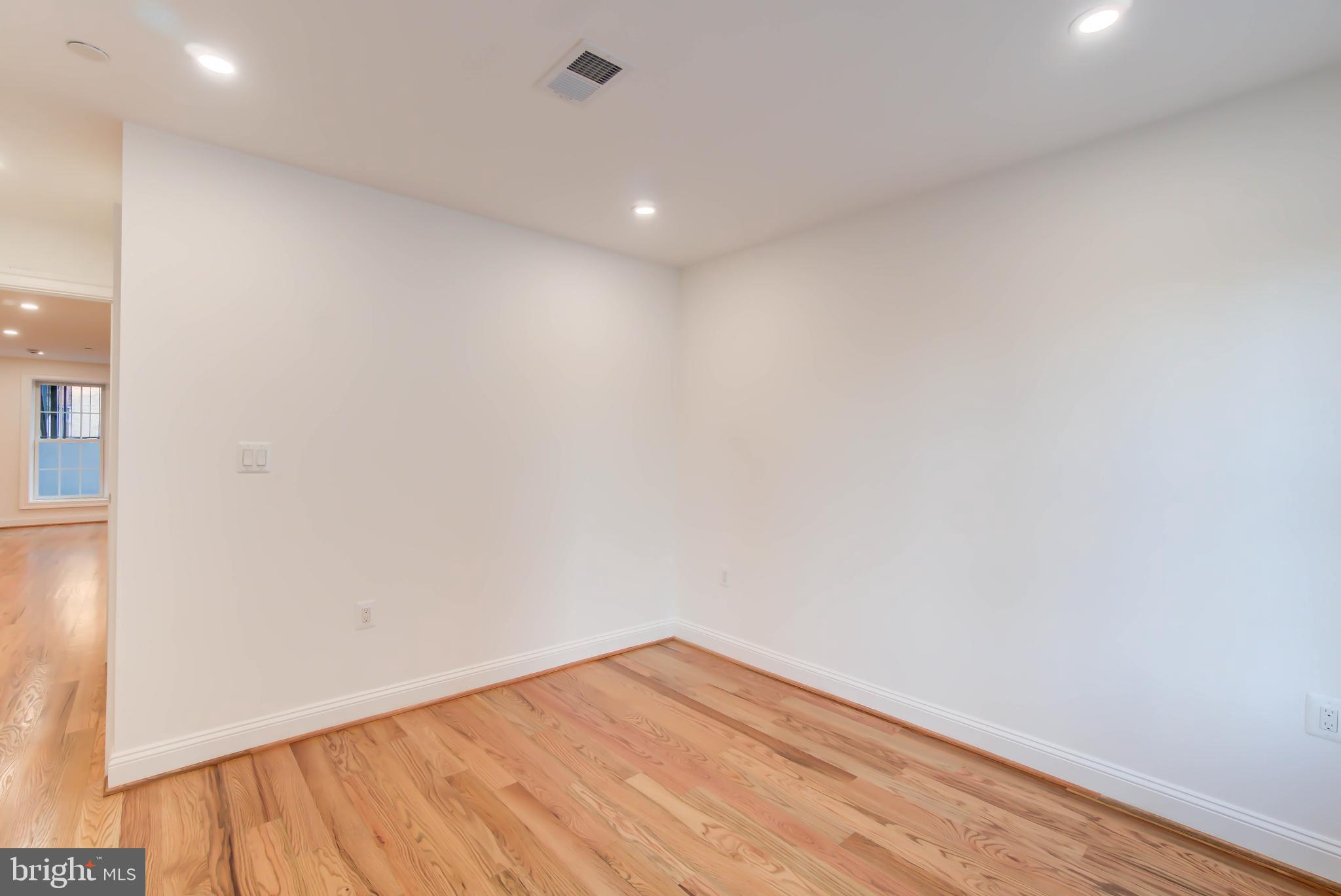 2910 18th Street Northwest Washington, DC 20009 - Photo 48 of 54 a view of empty room with wooden floor