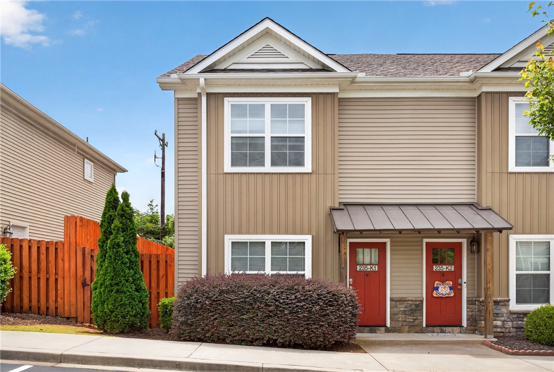 235 Pendleton Road, Unit K1 Clemson, SC 29631 - Photo 2 of 49 Two distinct entry doors with welcoming accents define this charming multi-unit facade.