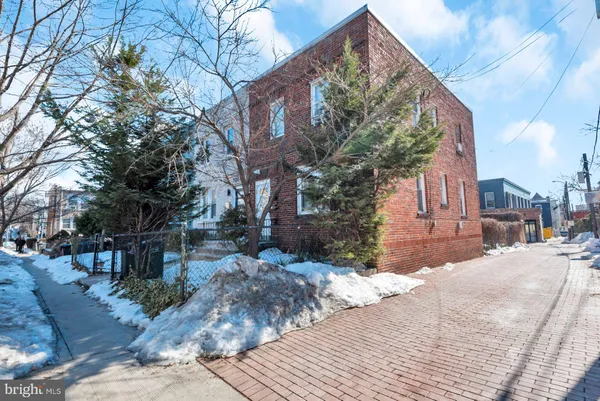 a view of a house with a snow in the yard