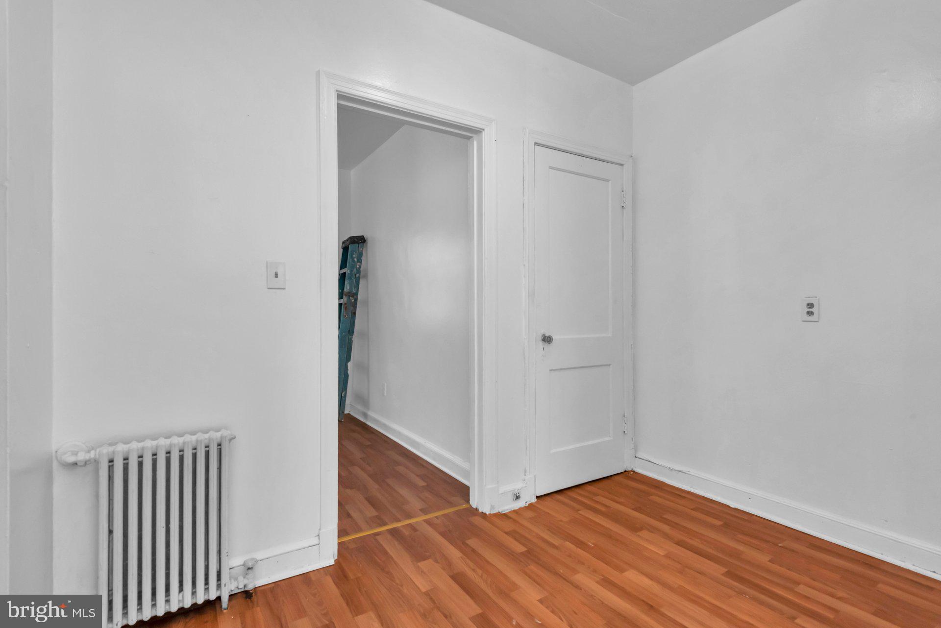 1016 Irving Street Northwest Washington, DC 20010 - Photo 11 of 37 a view of a hallway with wooden floor
