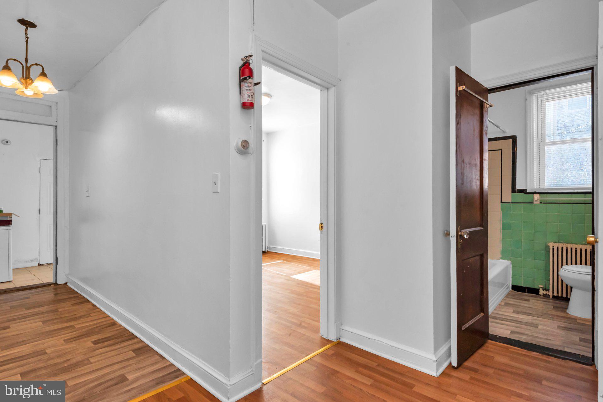 1016 Irving Street Northwest Washington, DC 20010 - Photo 12 of 37 a view of a hallway with wooden floor and entryway