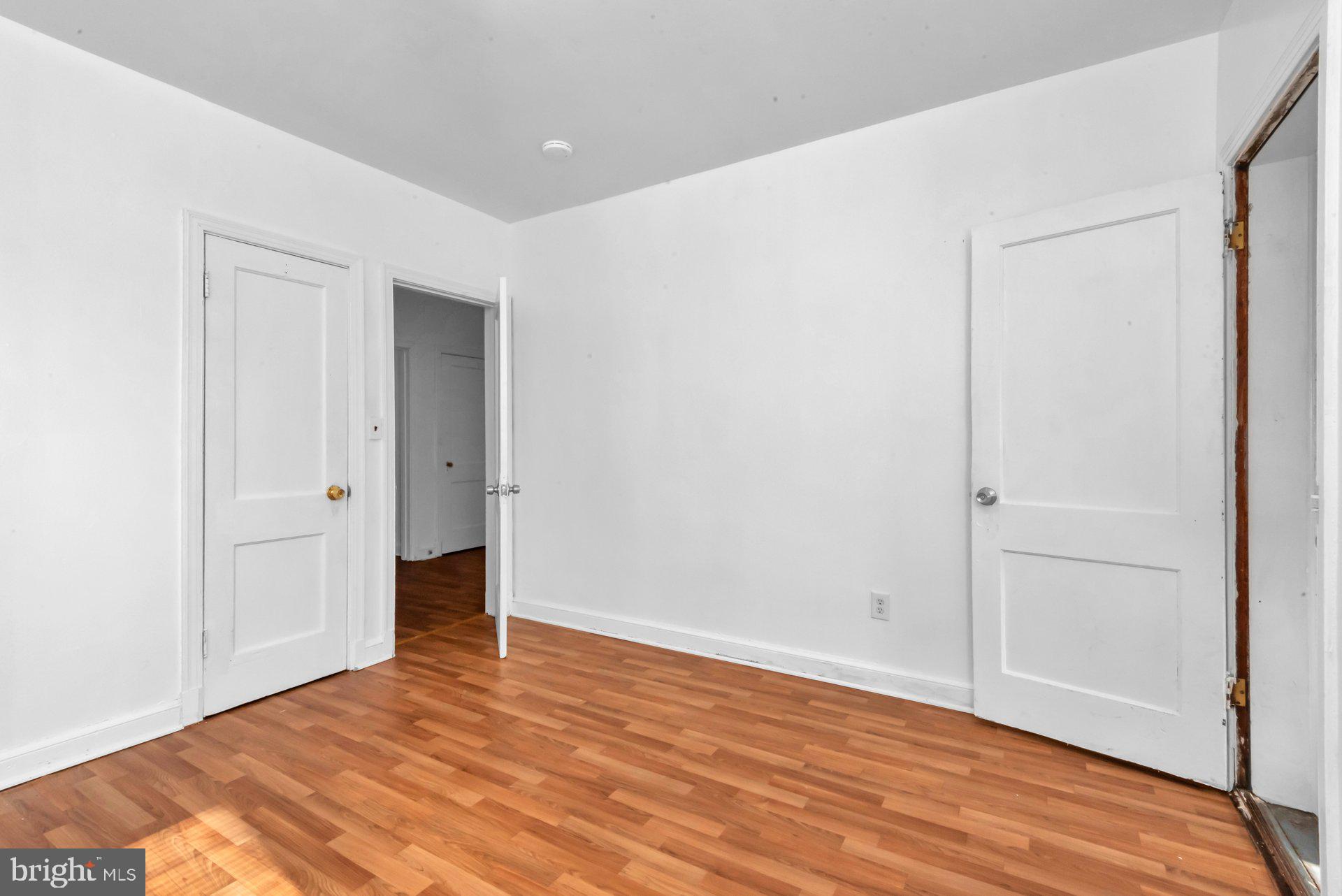 1016 Irving Street Northwest Washington, DC 20010 - Photo 13 of 37 a view of an empty room with wooden floor
