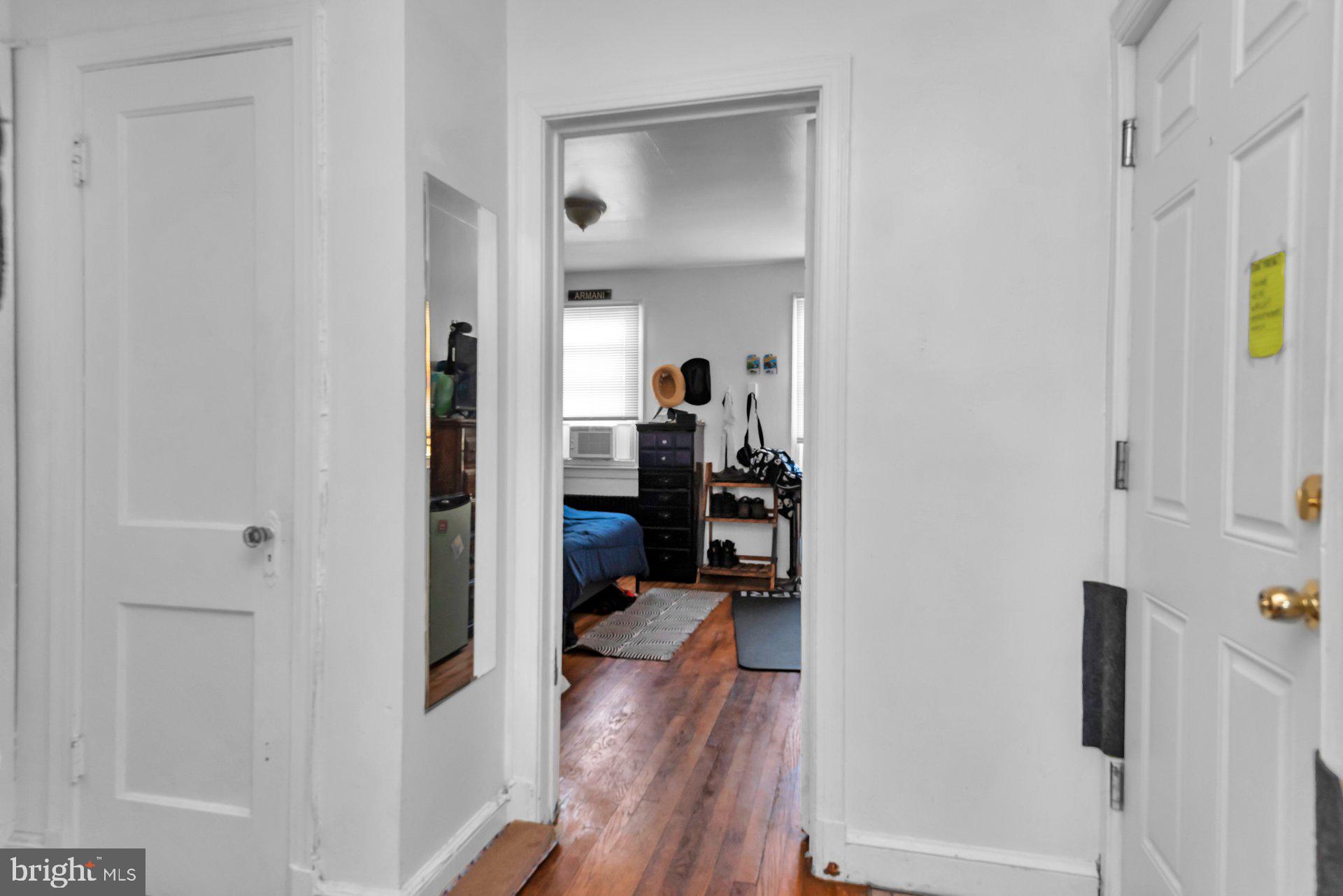 1016 Irving Street Northwest Washington, DC 20010 - Photo 31 of 37 a view of a bedroom from a hallway