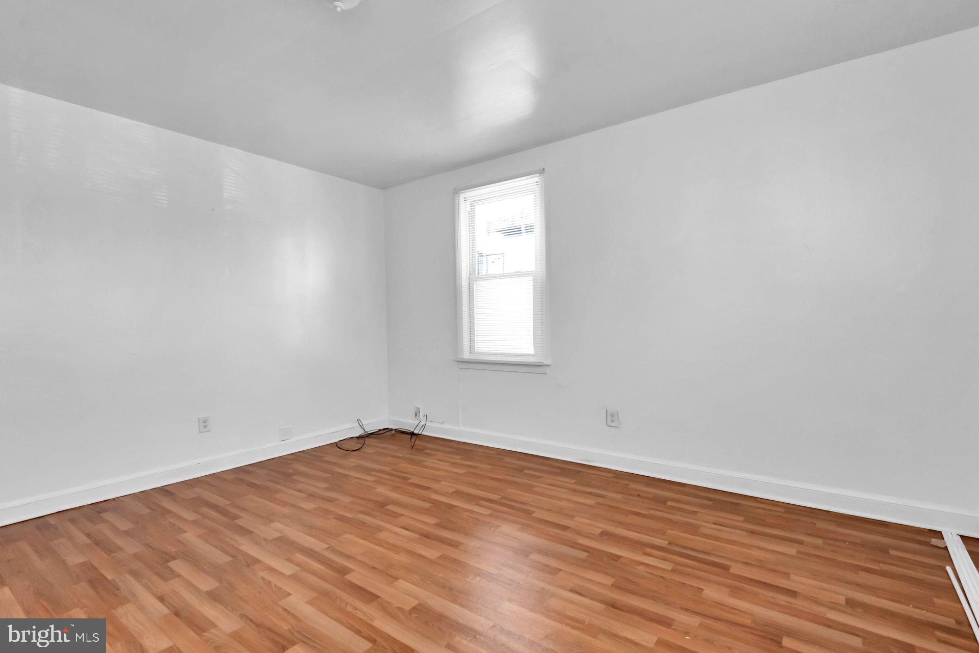 1016 Irving Street Northwest Washington, DC 20010 - Photo 5 of 37 a view of empty room with wooden floor and fan