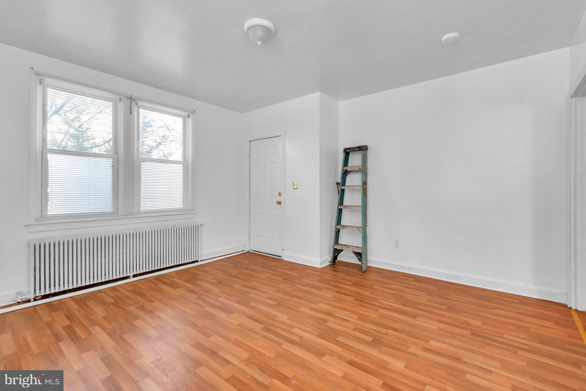 1016 Irving Street Northwest Washington, DC 20010 - Photo 7 of 37 a view of empty room with wooden floor and fan