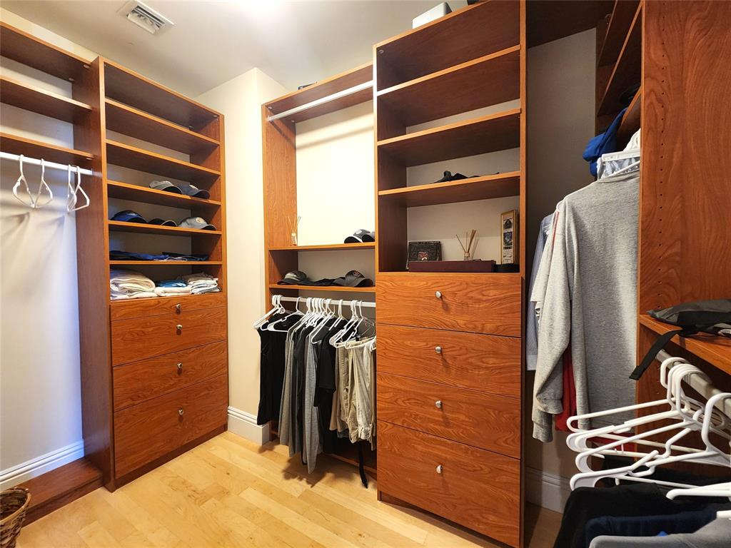 701 Southeast 21st Avenue, Unit 103 Deerfield Beach, FL 33441 - Photo 11 of 31 a view of walk in closet with clothes and shoes