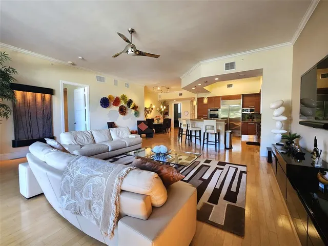 a living room with furniture fireplace and a flat screen tv