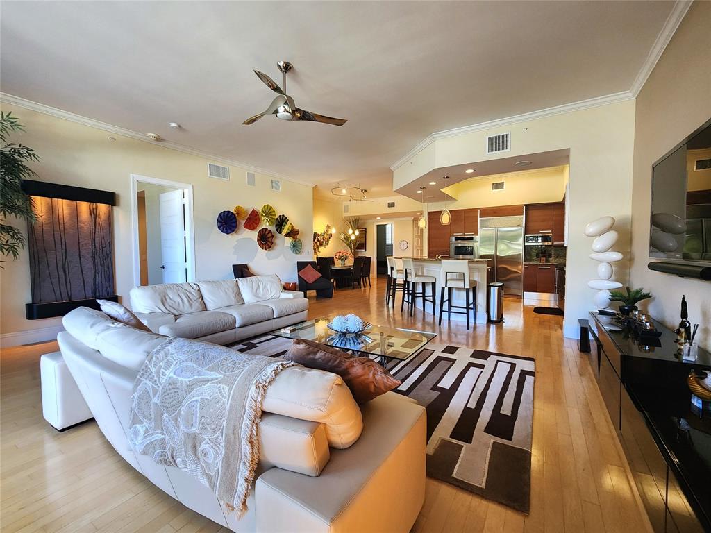 701 Southeast 21st Avenue, Unit 103 Deerfield Beach, FL 33441 - Photo 12 of 31 a living room with furniture fireplace and a flat screen tv