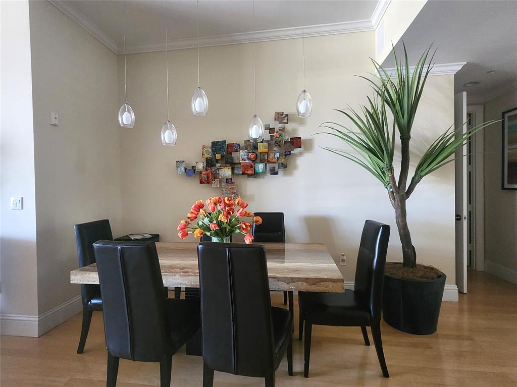 701 Southeast 21st Avenue, Unit 103 Deerfield Beach, FL 33441 - Photo 13 of 31 a view of a dining room with furniture and a potted plant