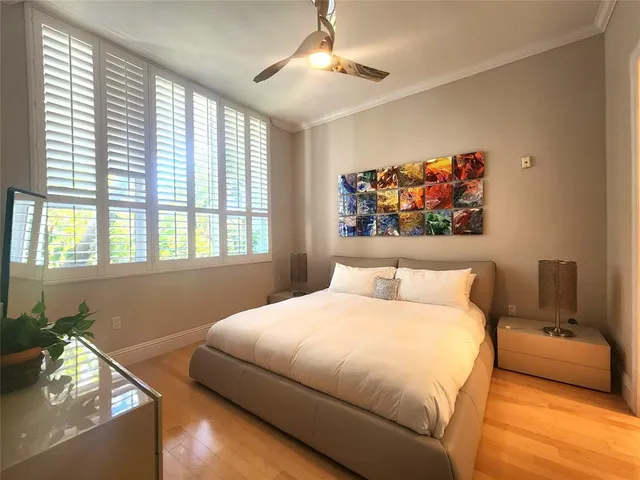 a bedroom with a bed and a couch