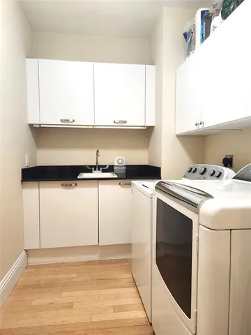 a utility room with washer and dryer