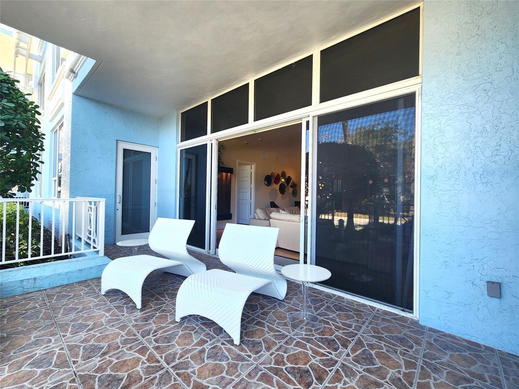 701 Southeast 21st Avenue, Unit 103 Deerfield Beach, FL 33441 - Photo 19 of 31 a living room with furniture