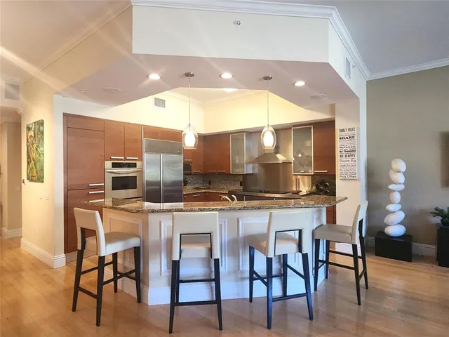 a kitchen with a table and chairs