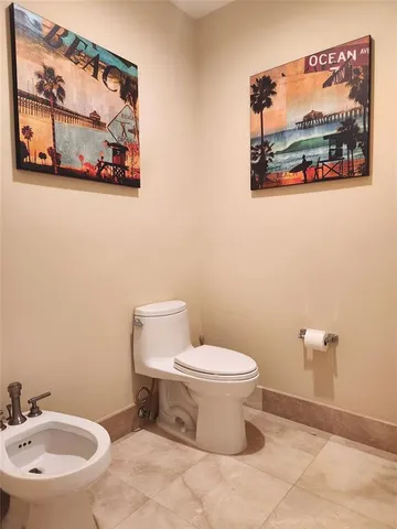 a bathroom with a toilet and a sink