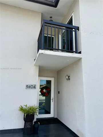a view of staircase with wooden floor and a potted plant