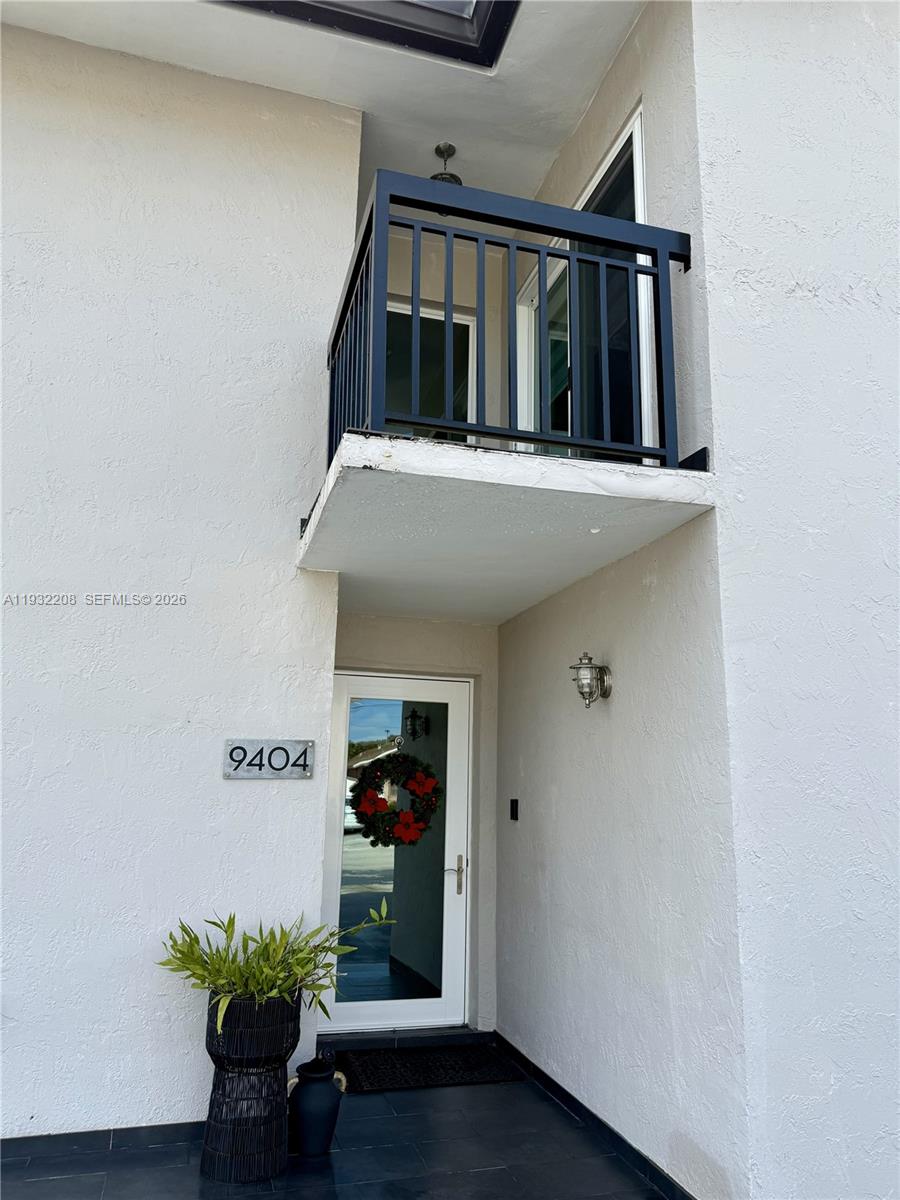 9404 Southwest 8th Terrace Miami, FL 33174 - Photo 2 of 41 a view of staircase with wooden floor and a potted plant