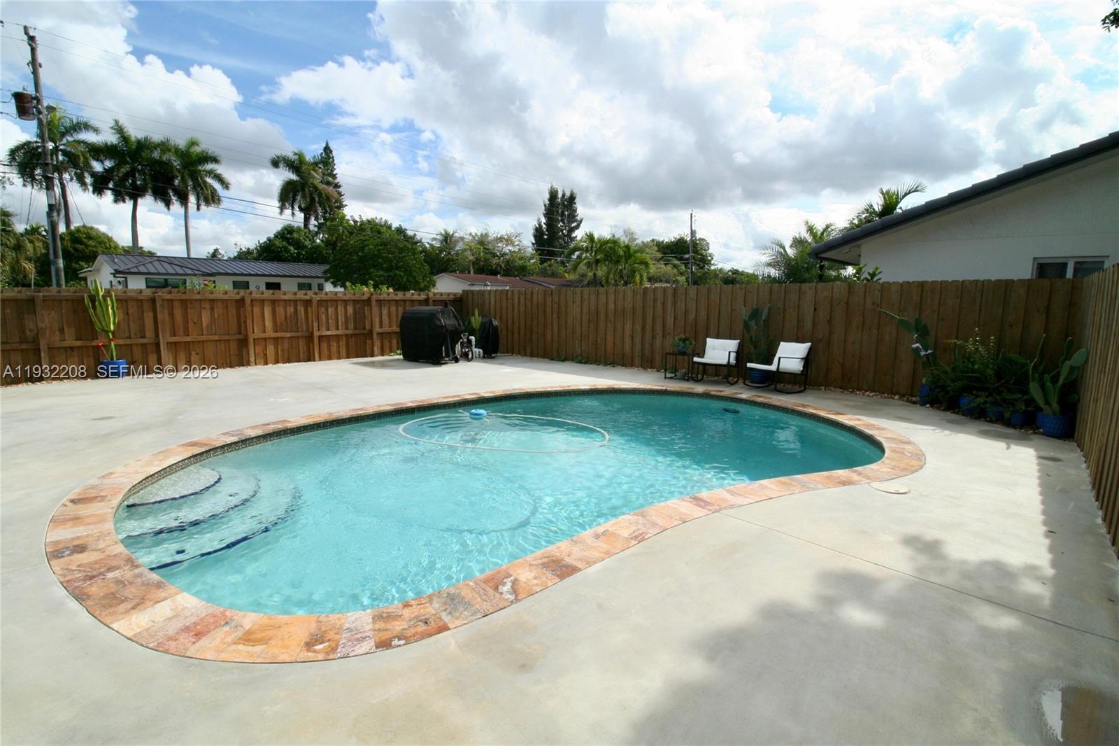 9404 Southwest 8th Terrace Miami, FL 33174 - Photo 7 of 41 a view of a swimming pool with a yard
