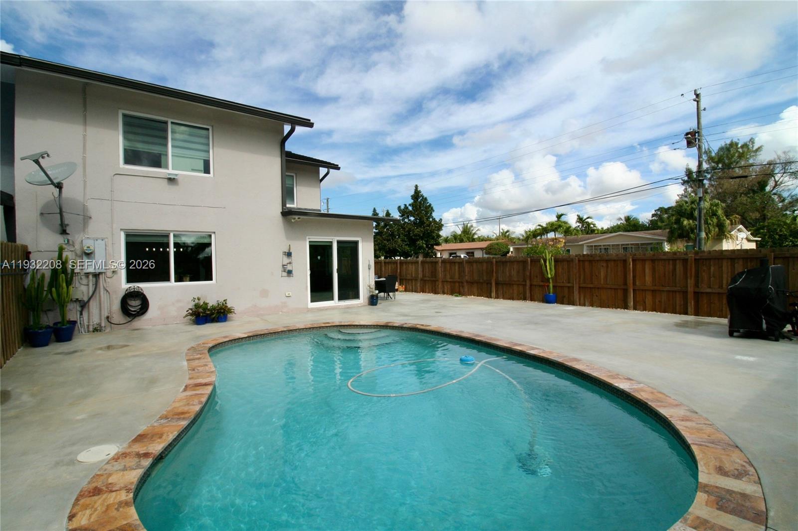 9404 Southwest 8th Terrace Miami, FL 33174 - Photo 8 of 41 a swimming pool with yard and outdoor seating