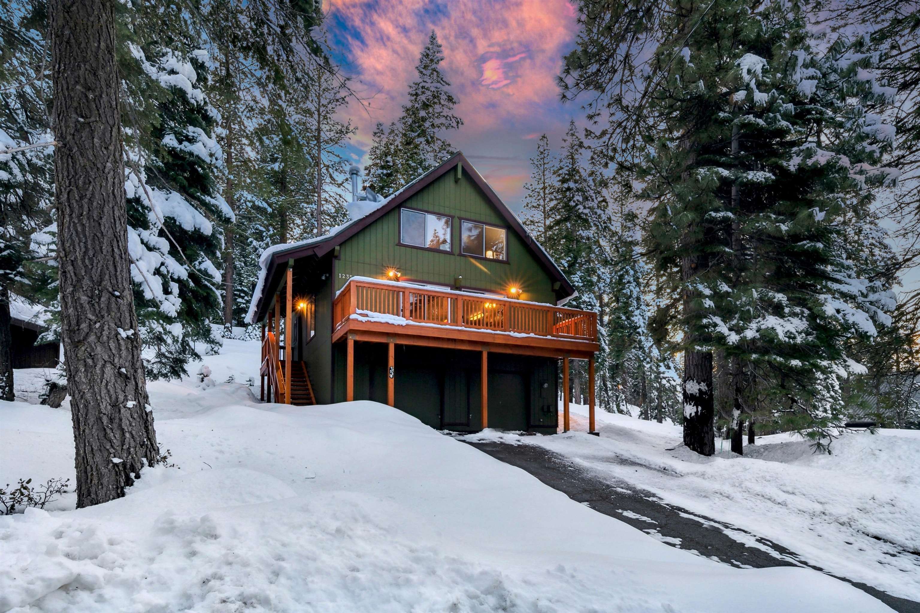 12354 Rainbow Drive Truckee, CA 96161 - Photo 19 of 23 a view of a house with large windows and a large tree