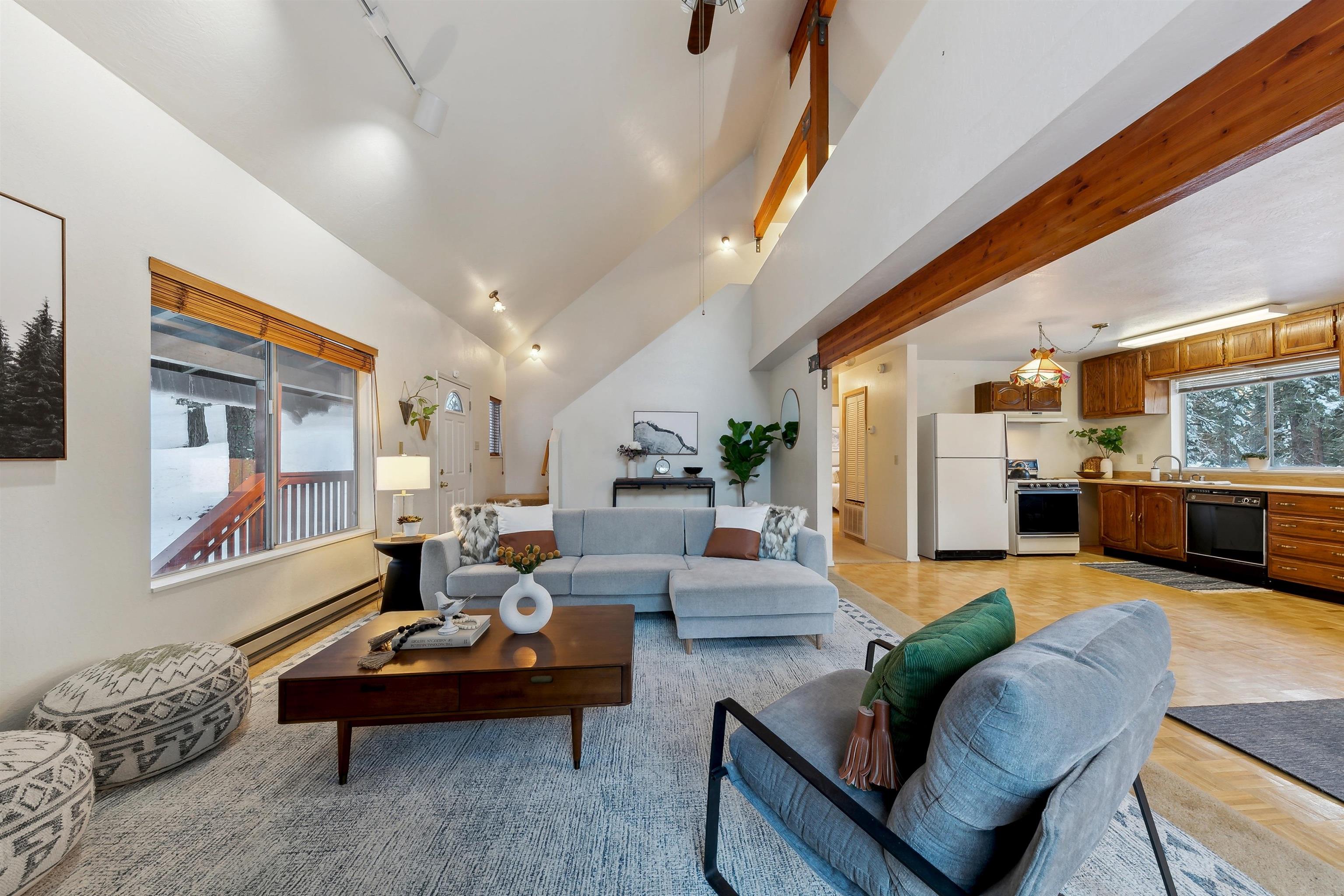 12354 Rainbow Drive Truckee, CA 96161 - Photo 5 of 23 a living room with furniture fireplace and a large window