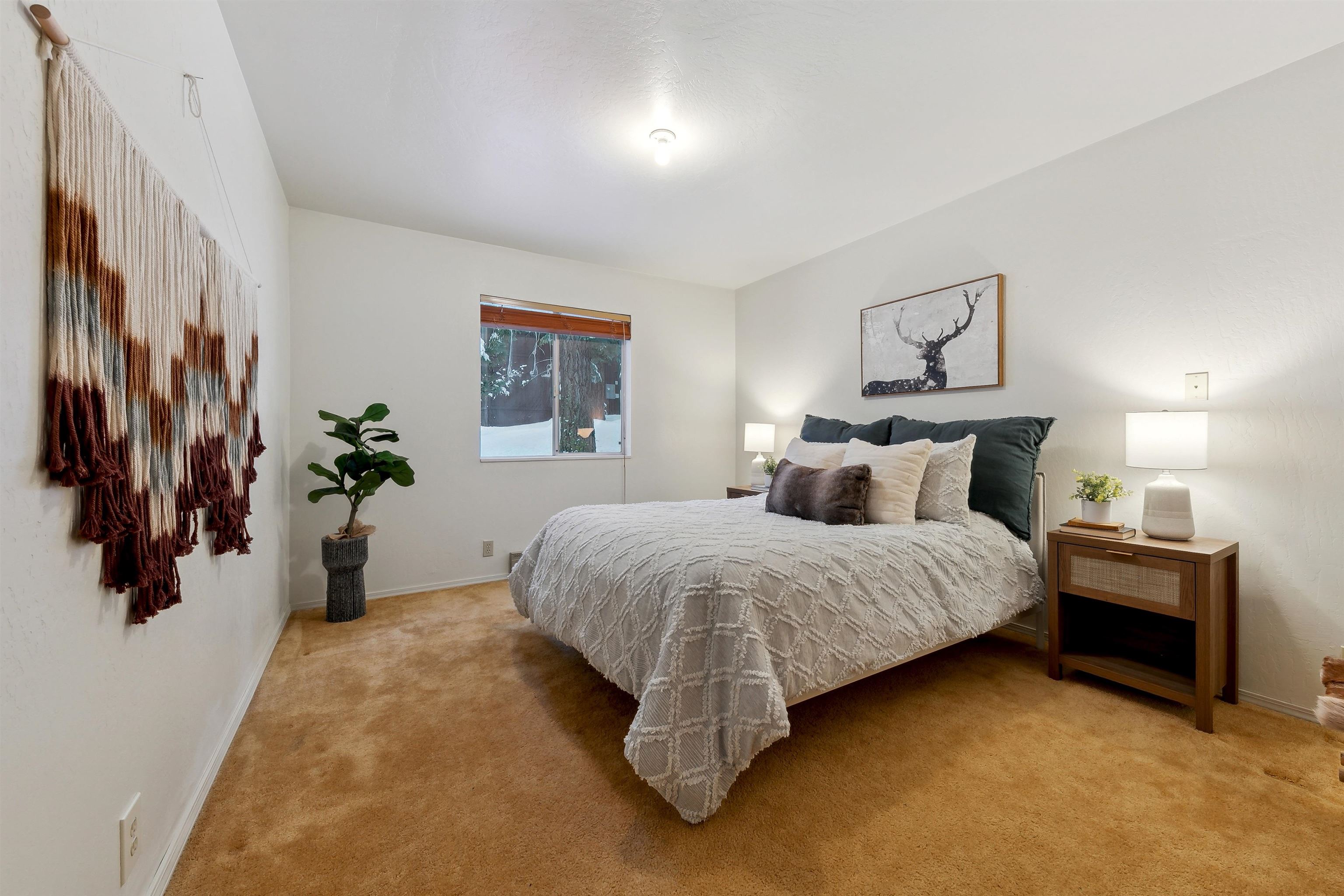 12354 Rainbow Drive Truckee, CA 96161 - Photo 8 of 23 a bedroom with a bed and a painting on the wall