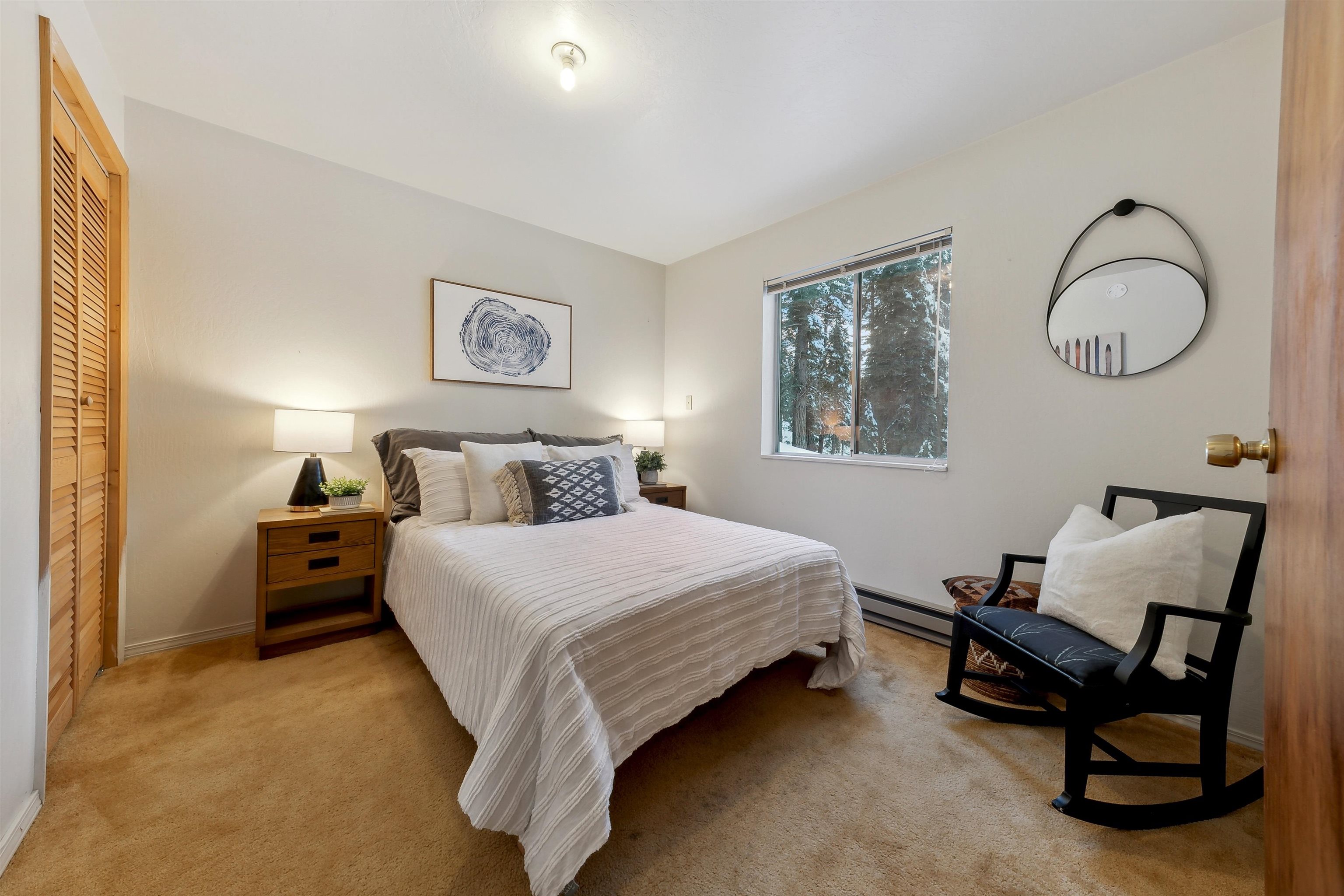 12354 Rainbow Drive Truckee, CA 96161 - Photo 9 of 23 a spacious bedroom with a bed and chair