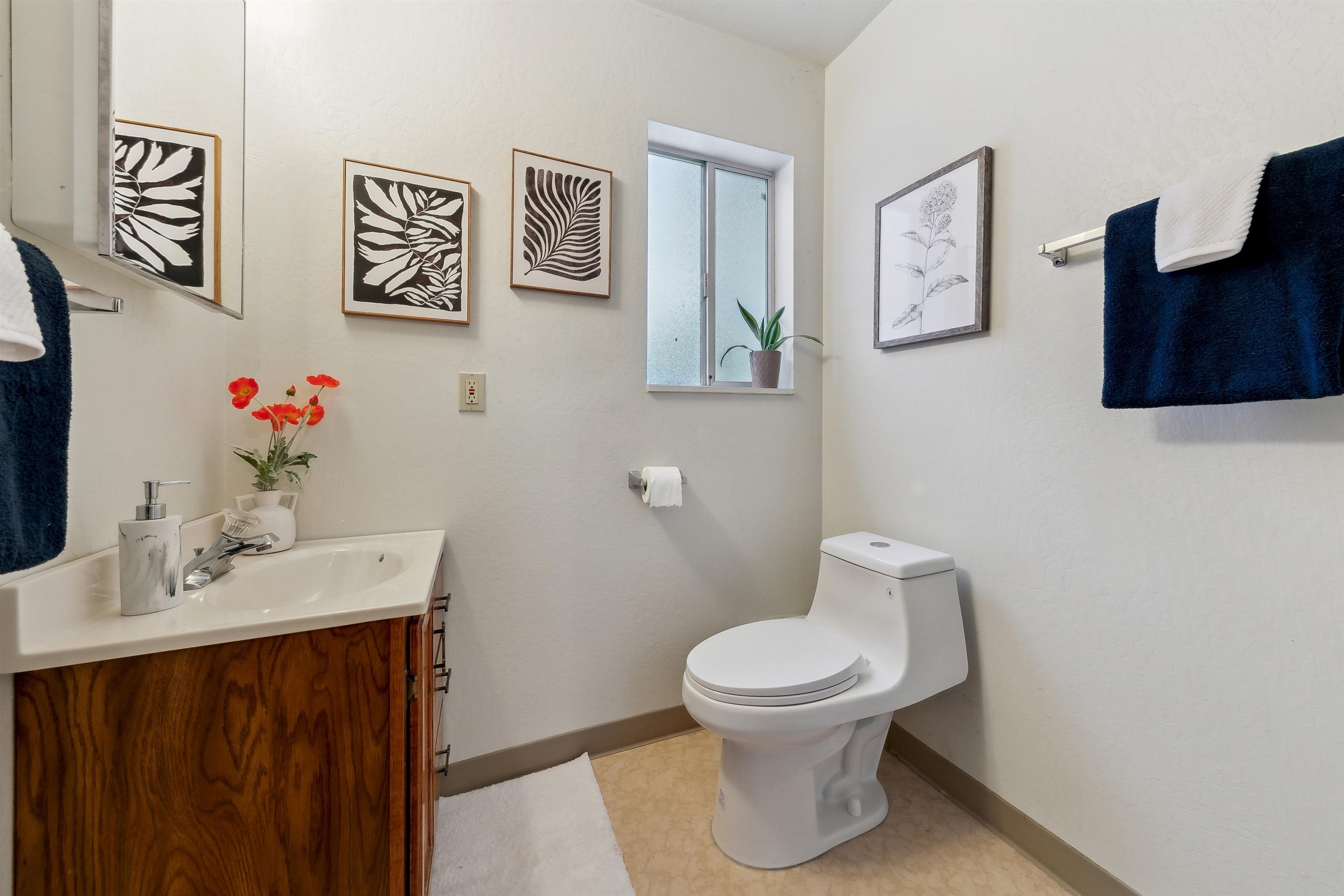 12354 Rainbow Drive Truckee, CA 96161 - Photo 10 of 23 a white toilet sitting next to a bathroom sink