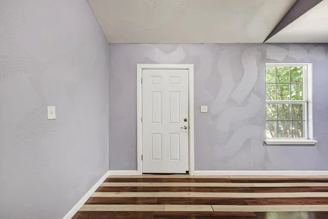 a bathroom with a vanity and a window