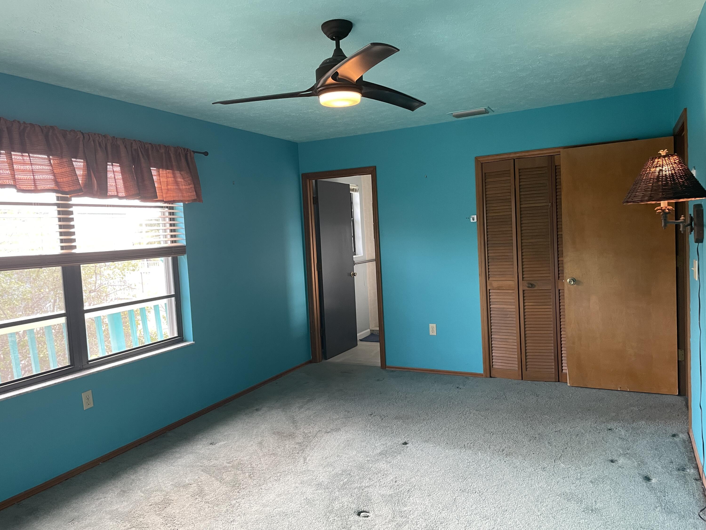 744 Blackbeard Road Summerland Key, FL 33042 - Photo 16 of 39 an empty room with closet and windows