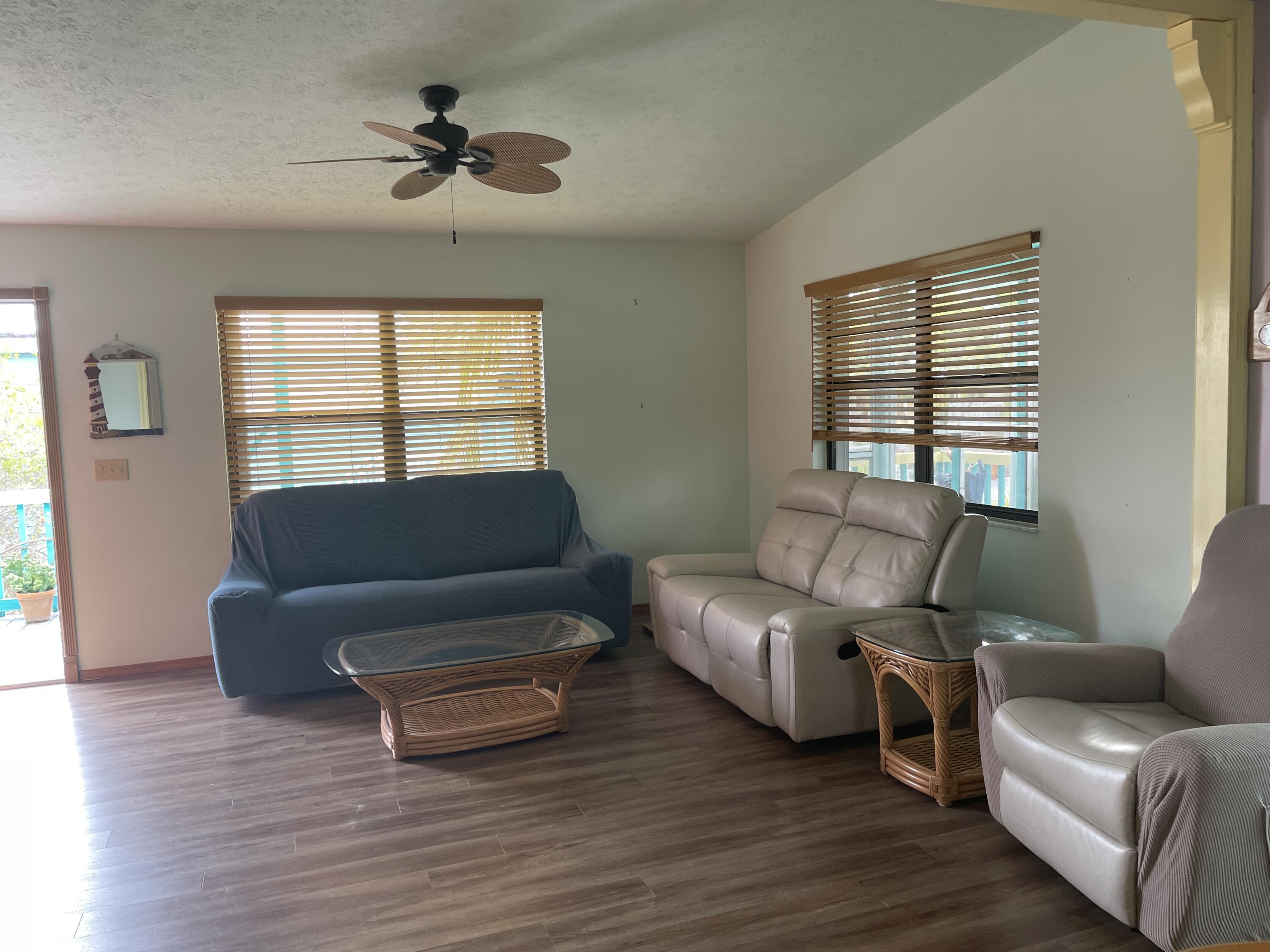 744 Blackbeard Road Summerland Key, FL 33042 - Photo 19 of 39 a living room with furniture and a window