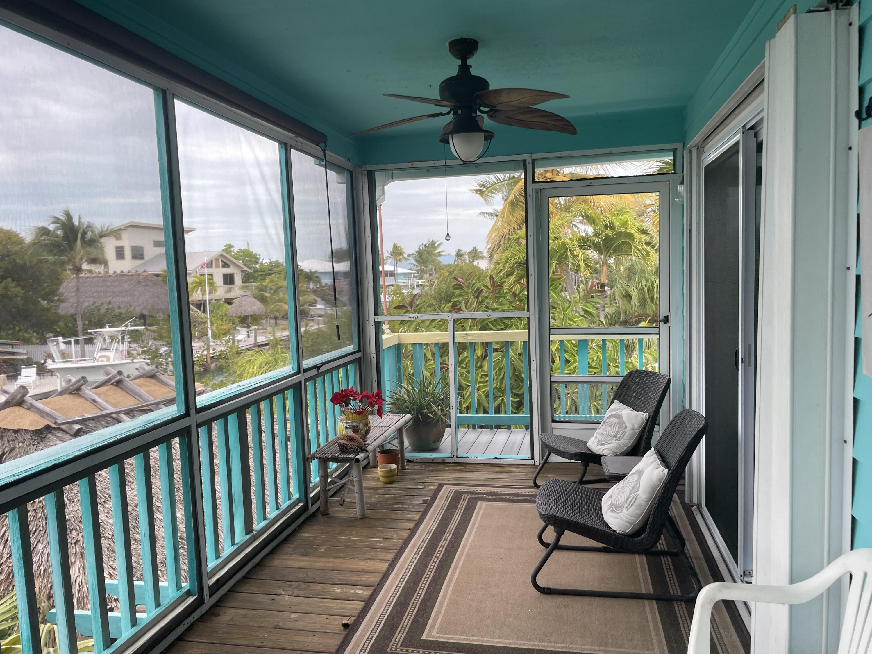 744 Blackbeard Road Summerland Key, FL 33042 - Photo 21 of 39 a view of a balcony with chairs