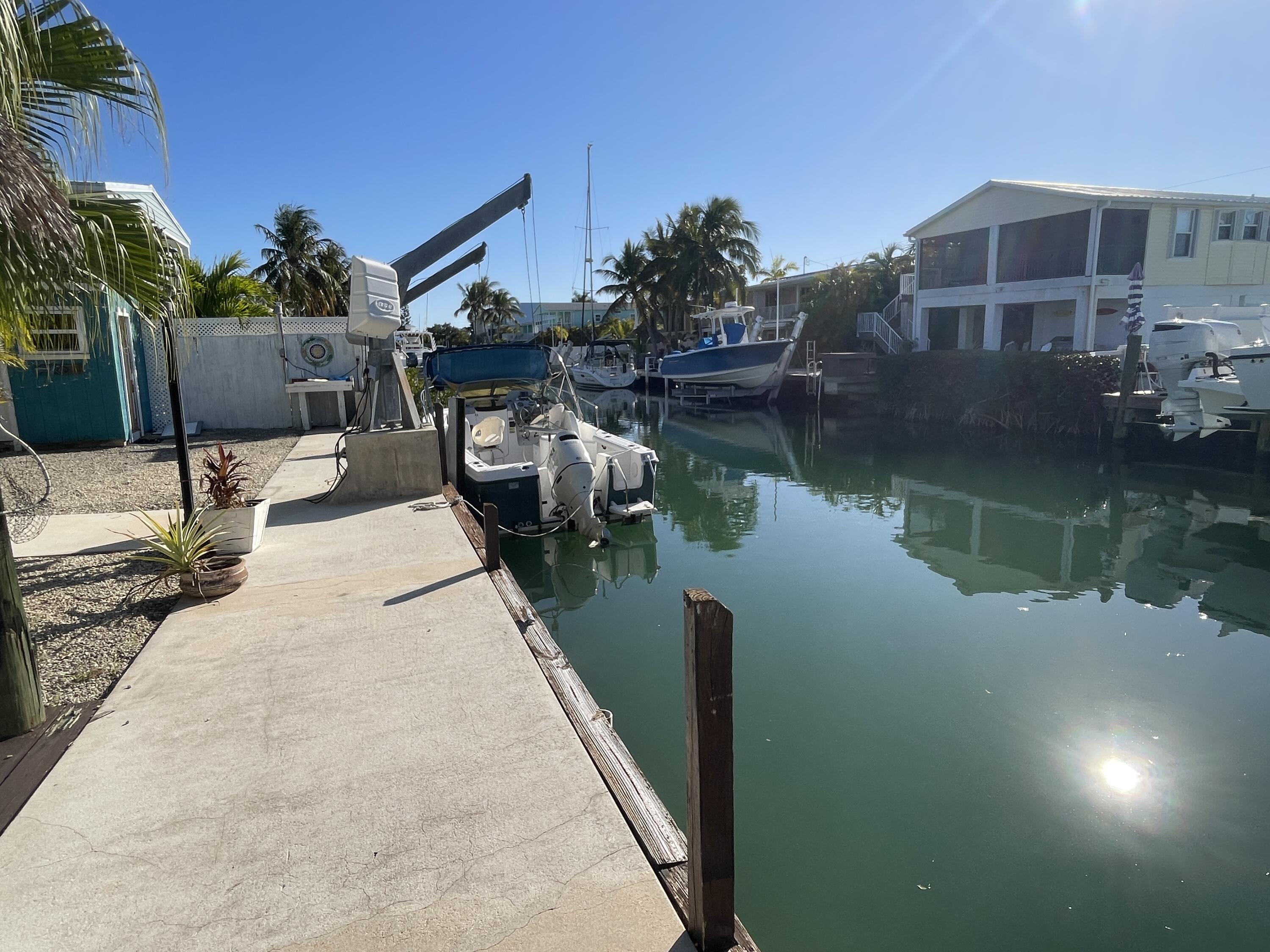 744 Blackbeard Road Summerland Key, FL 33042 - Photo 33 of 39 a view of a house with a lake view