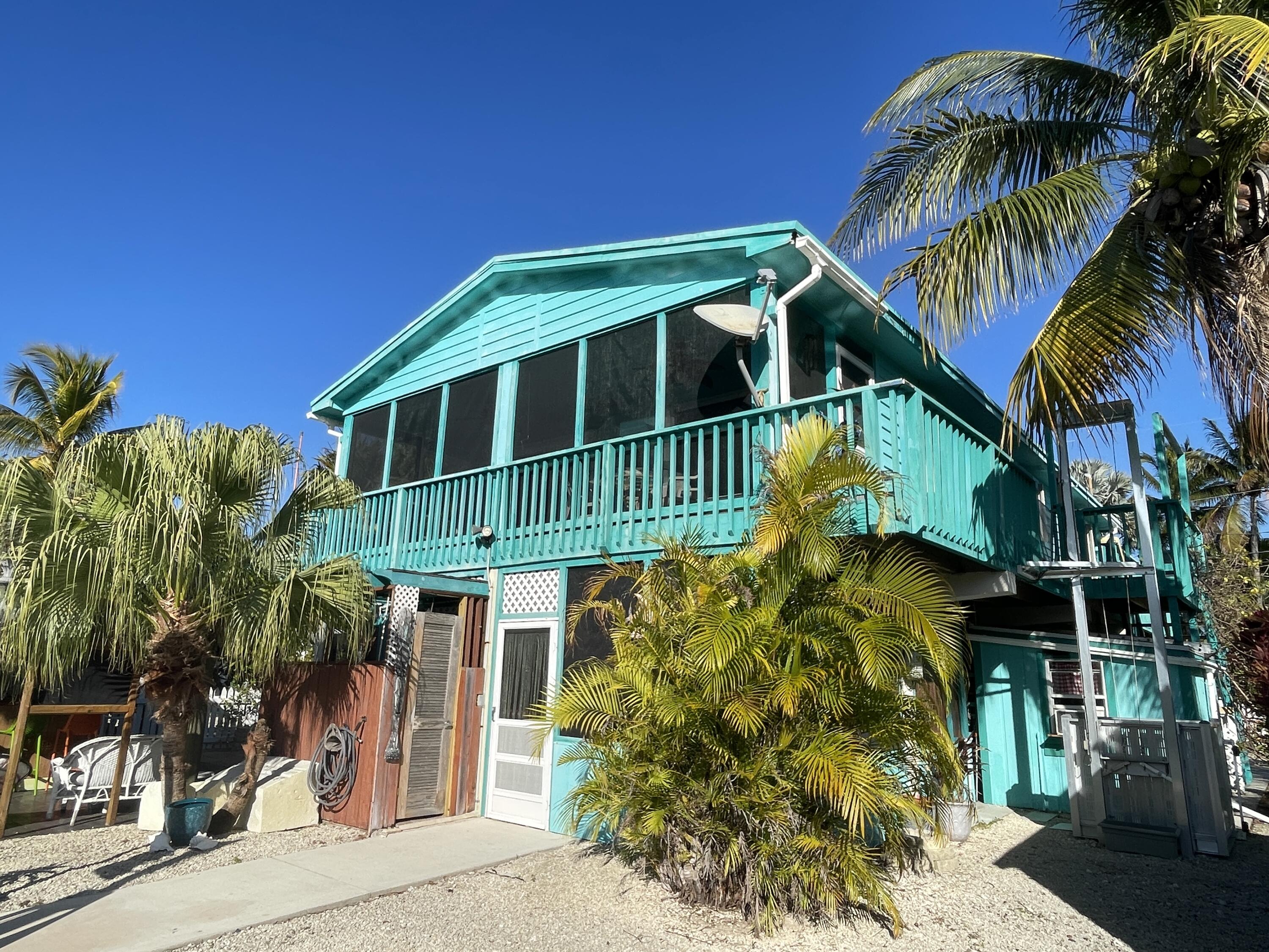 744 Blackbeard Road Summerland Key, FL 33042 - Photo 35 of 39 a front view of house with a yard