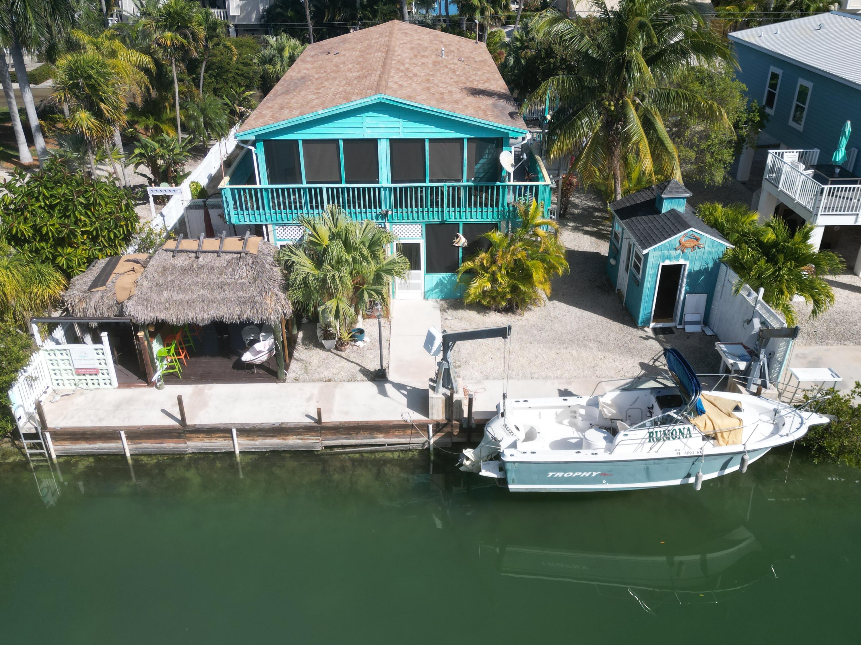 744 Blackbeard Road Summerland Key, FL 33042 - Photo 39 of 39 a view of a house with a yard
