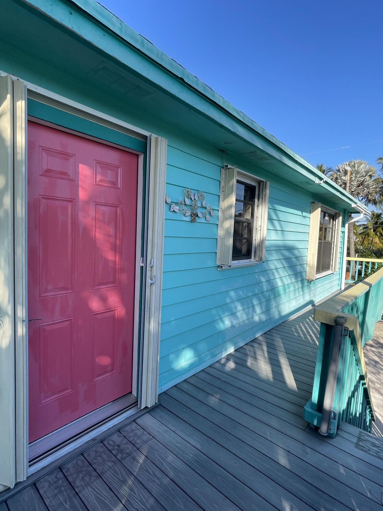 744 Blackbeard Road Summerland Key, FL 33042 - Photo 6 of 39 a house with wooden walls