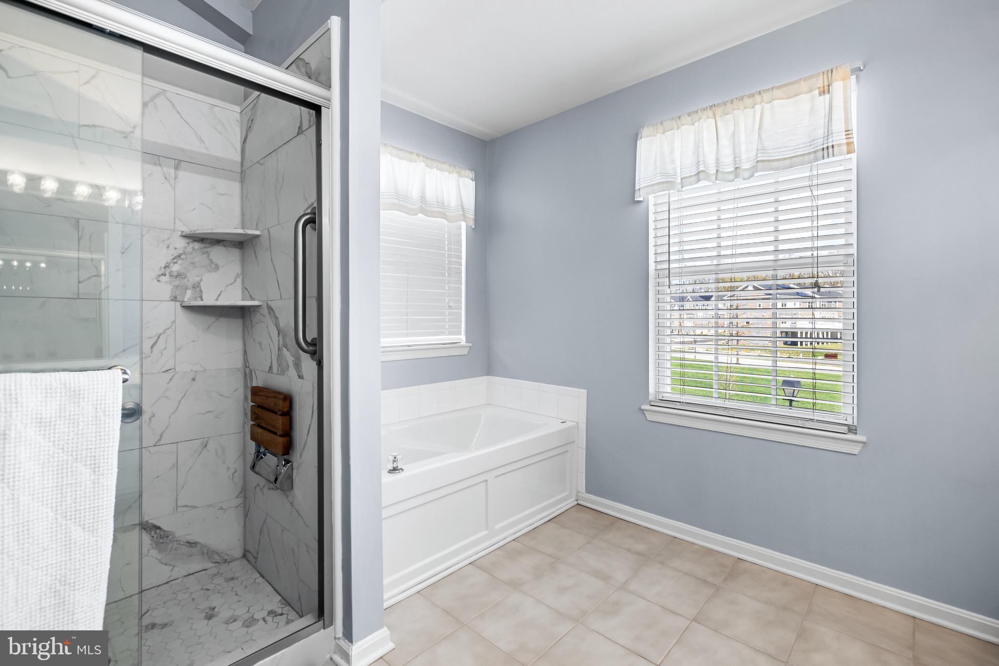 1713 Mystic Circle Baltimore, MD 21221 - Photo 20 of 37 a bathroom with a bathtub and a shower