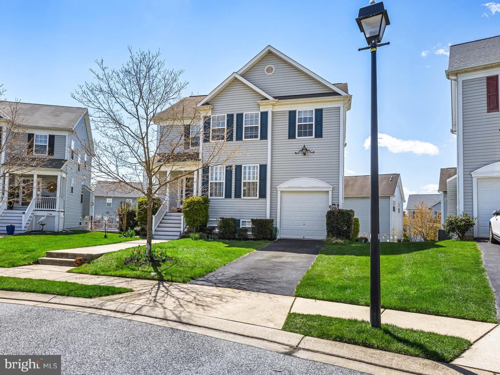 1713 Mystic Circle Baltimore, MD 21221 - Photo 2 of 37 a front view of a house with a yard