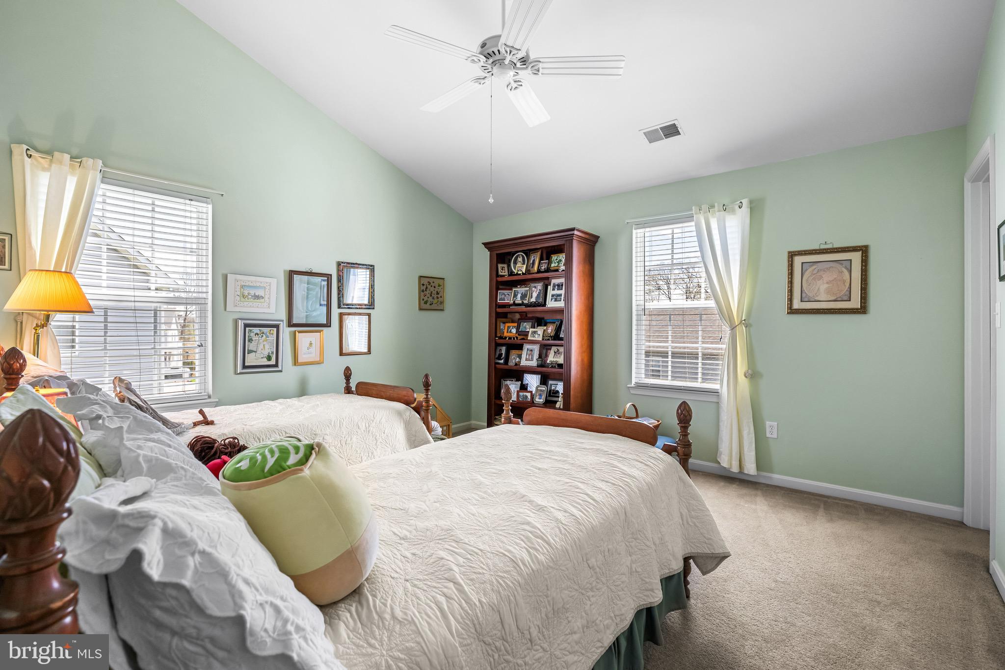 1713 Mystic Circle Baltimore, MD 21221 - Photo 23 of 37 a spacious bedroom with a bed a dresser and a book shelf