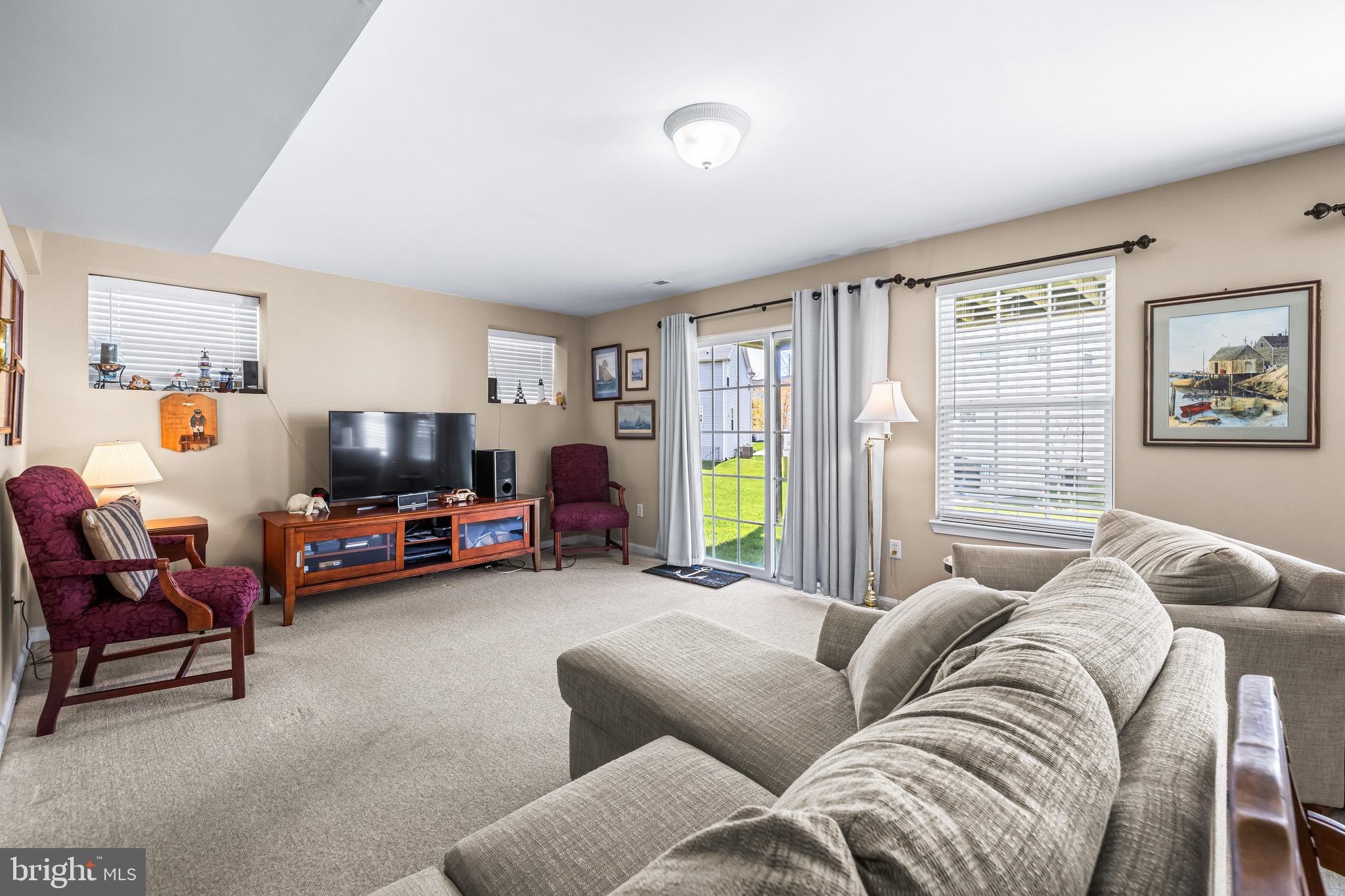 1713 Mystic Circle Baltimore, MD 21221 - Photo 27 of 37 a living room with furniture and a flat screen tv