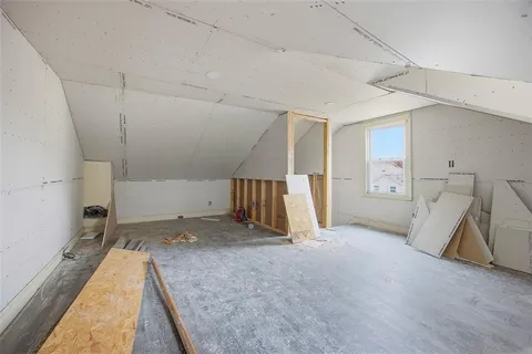 a view of a storage & utility room with two washing machine