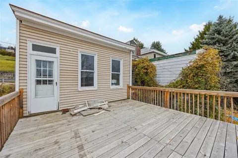 a view of a house with a roof deck
