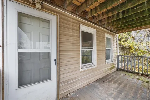 a view of a porch of a house