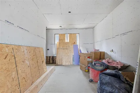 a bedroom with furniture and a chandelier