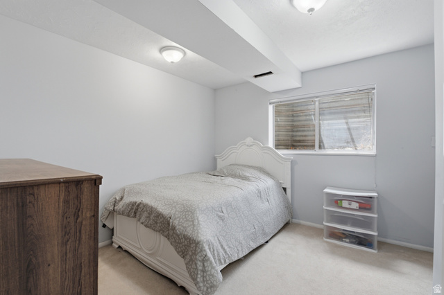 5788 Walden Ridge Drive Murray, UT 84123 - Photo 19 of 29 Bedroom featuring light-colored carpeting, a window with blinds, and recessed lighting
