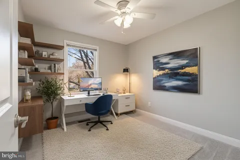 a workspace with furniture and window